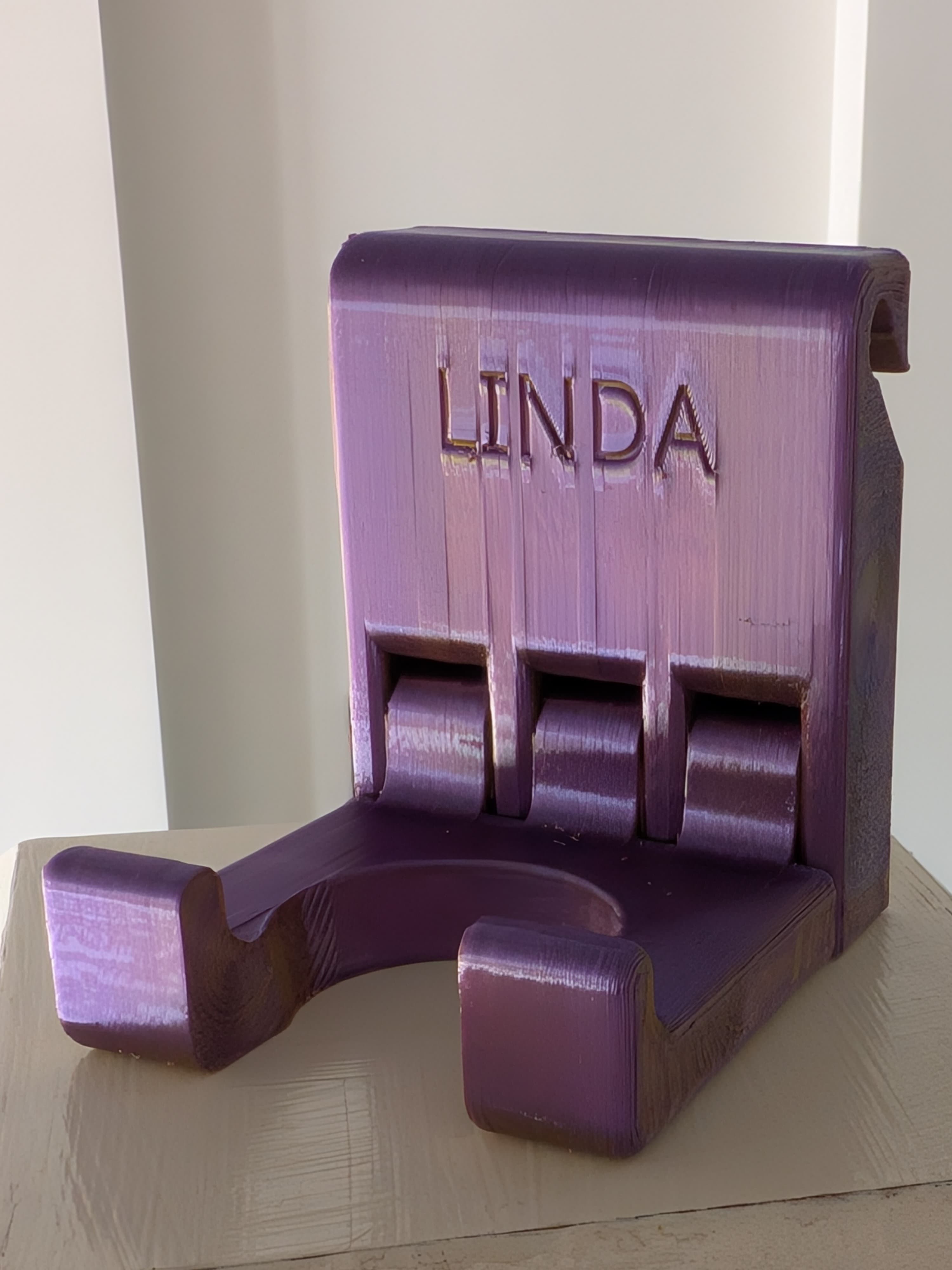 Purple BattyUp bat holder personalised with the name Linda